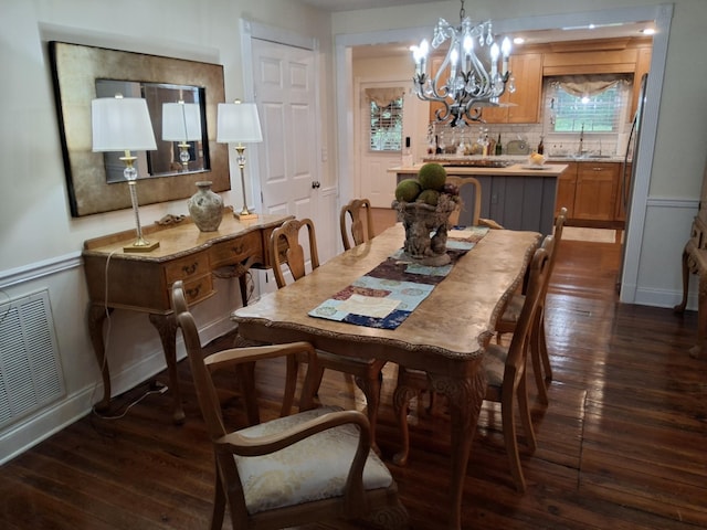 900 Sorghum Hollow Rd, Pulaski, TN 38478 - dining room with dark wood finished floors and a chandelier
