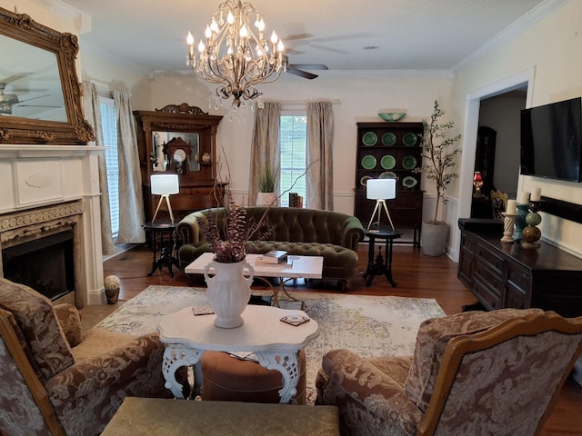 900 Sorghum Hollow Rd, Pulaski, TN 38478 - living room featuring a ceiling fan, a fireplace, wood finished floors, crown molding, and a chandelier