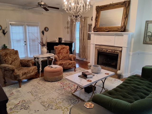 900 Sorghum Hollow Rd, Pulaski, TN 38478 - living room with a ceiling fan, a fireplace with flush hearth, wood finished floors, ornamental molding, and a chandelier