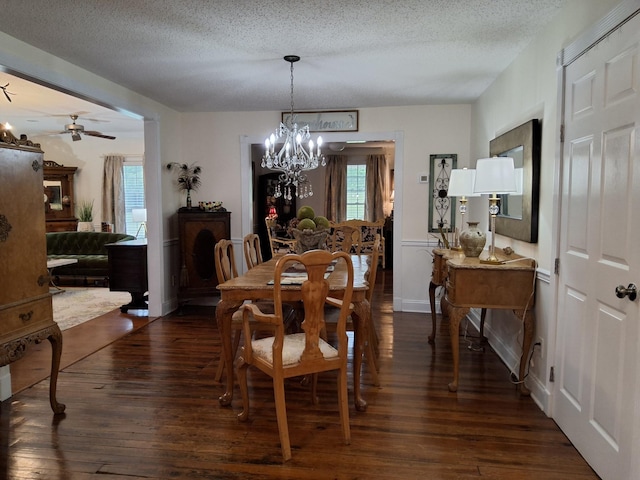 900 Sorghum Hollow Rd, Pulaski, TN 38478 - dining space with a chandelier, dark wood-style flooring, a textured ceiling, and a ceiling fan