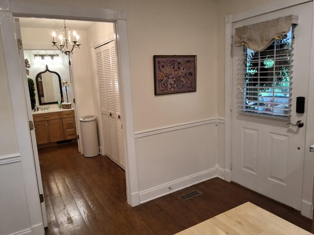900 Sorghum Hollow Rd, Pulaski, TN 38478 - foyer featuring a chandelier, dark wood-style floors, and baseboards
