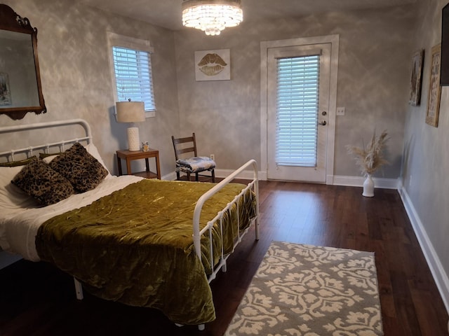 900 Sorghum Hollow Rd, Pulaski, TN 38478 - bedroom featuring wood-type flooring, a chandelier, and baseboards
