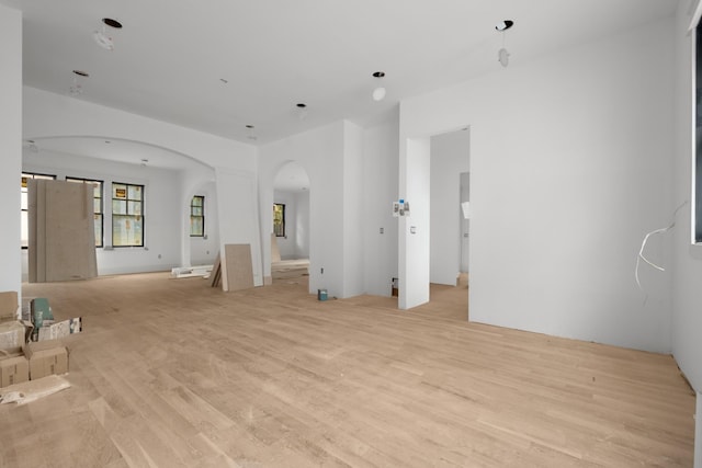 1014 Bate Ave, Nashville, TN 37204 - unfurnished living room featuring arched walkways and light wood-type flooring