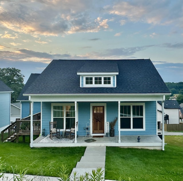 111 Madeleine Way, Kingston Springs, TN 37082 - rear view of house with a yard, covered porch, and a shingled roof