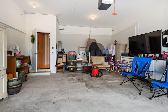111 Madeleine Way, Kingston Springs, TN 37082 - garage featuring a garage door opener and electric panel