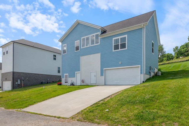 111 Madeleine Way, Kingston Springs, TN 37082 - rear view of house featuring a garage, driveway, a lawn, and central AC