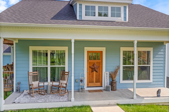 111 Madeleine Way, Kingston Springs, TN 37082 - doorway to property with covered porch and roof with shingles