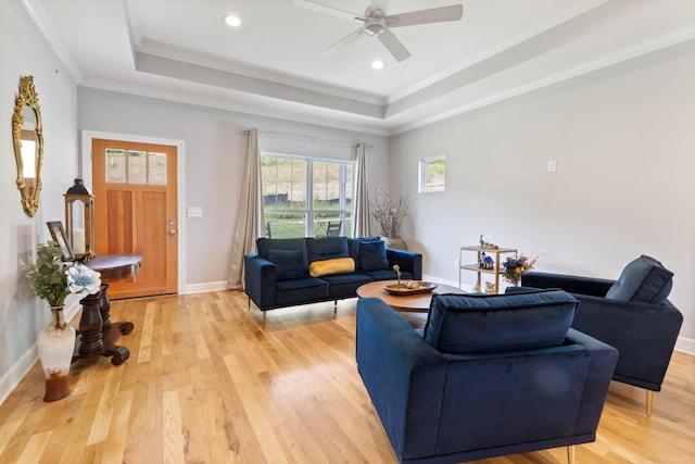 111 Madeleine Way, Kingston Springs, TN 37082 - living room with a raised ceiling, light wood-style floors, ornamental molding, ceiling fan, and baseboards