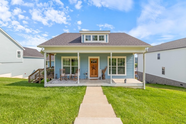 111 Madeleine Way, Kingston Springs, TN 37082 - view of front facade with a front lawn, covered porch, and a shingled roof