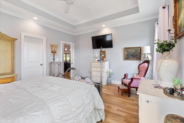 111 Madeleine Way, Kingston Springs, TN 37082 - bedroom featuring a tray ceiling, light wood-type flooring, ornamental molding, recessed lighting, and a ceiling fan