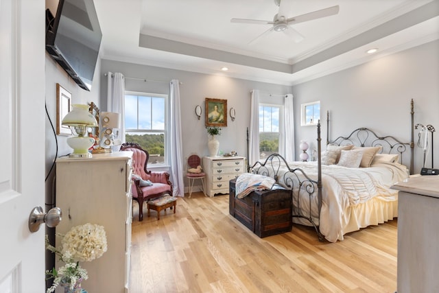111 Madeleine Way, Kingston Springs, TN 37082 - bedroom with crown molding, light wood-style floors, a raised ceiling, multiple windows, and a ceiling fan