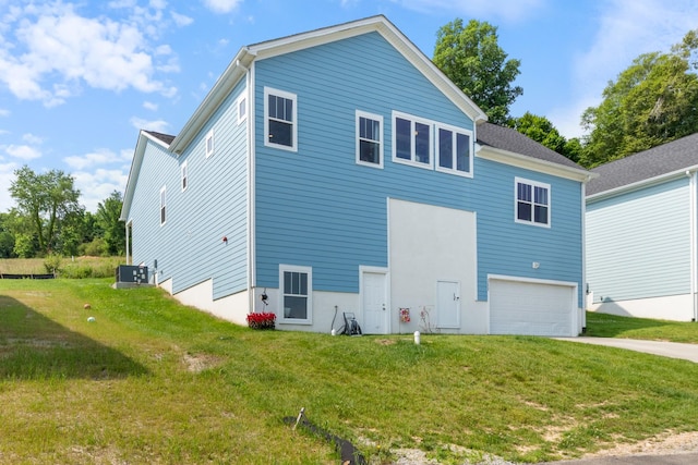 111 Madeleine Way, Kingston Springs, TN 37082 - rear view of property with a garage, driveway, central AC unit, and a lawn