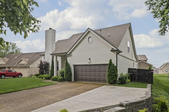 904 Park Crest Ct, Mount Juliet, TN 37122 - view of side of property with a garage, a chimney, concrete driveway, roof with shingles, and brick siding