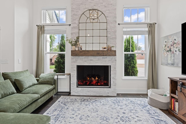 904 Park Crest Ct, Mount Juliet, TN 37122 - living area featuring a high ceiling, dark wood finished floors, a fireplace, healthy amount of natural light, and baseboards
