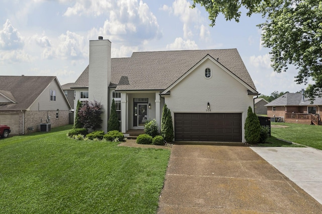 904 Park Crest Ct, Mount Juliet, TN 37122 - view of front of property with concrete driveway, a chimney, a front yard, central AC unit, and an attached garage