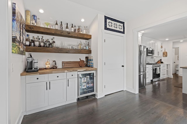 904 Park Crest Ct, Mount Juliet, TN 37122 - indoor bar featuring appliances with stainless steel finishes, beverage cooler, dark wood-style floors, baseboards, and recessed lighting
