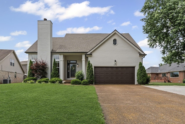 904 Park Crest Ct, Mount Juliet, TN 37122 - view of front of home featuring driveway, cooling unit, a chimney, a front lawn, and roof with shingles