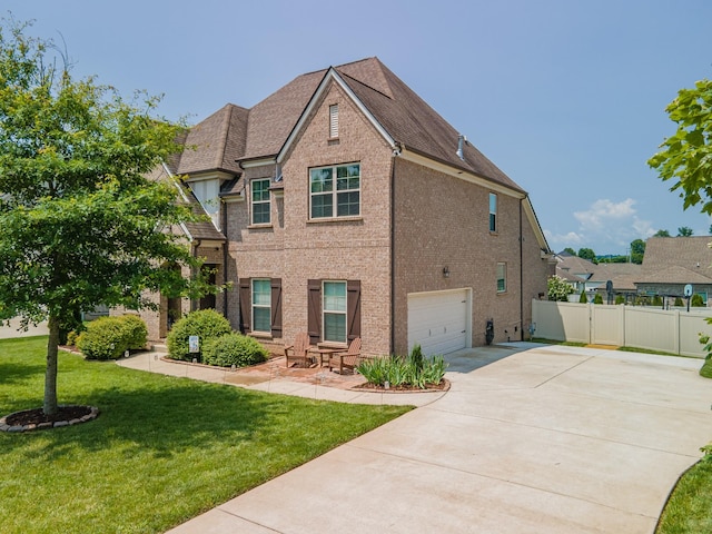 705 Rain Meadow Ct, Spring Hill, TN 37174 - view of front of home with an attached garage, concrete driveway, and brick siding