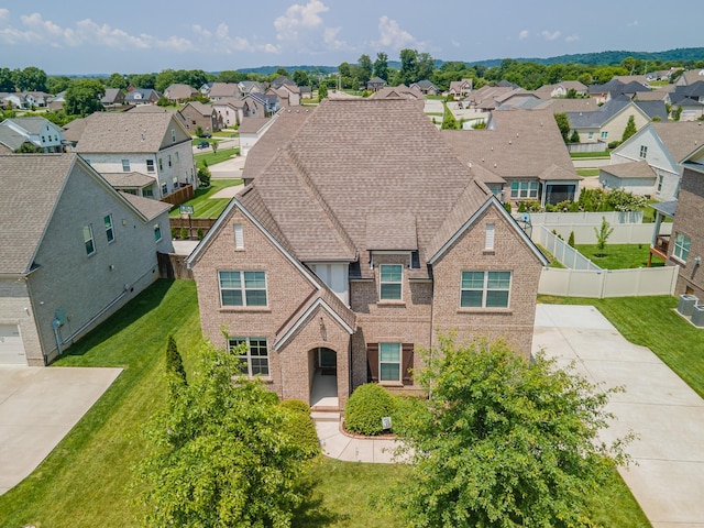 705 Rain Meadow Ct, Spring Hill, TN 37174 - traditional home featuring brick siding, a residential view, and concrete driveway