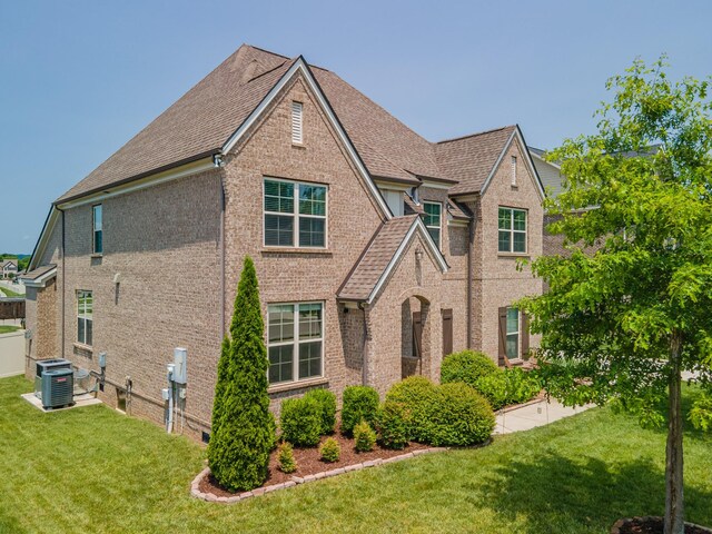 705 Rain Meadow Ct, Spring Hill, TN 37174 - view of front of property featuring brick siding, a front yard, and roof with shingles