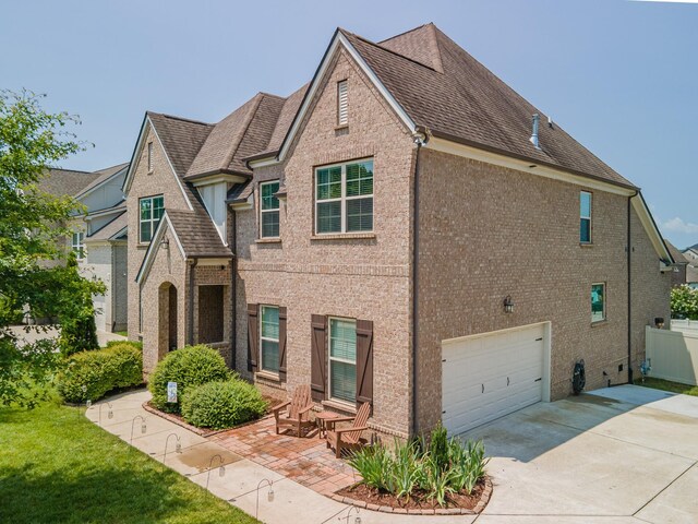 705 Rain Meadow Ct, Spring Hill, TN 37174 - view of front of property with a garage, concrete driveway, and brick siding