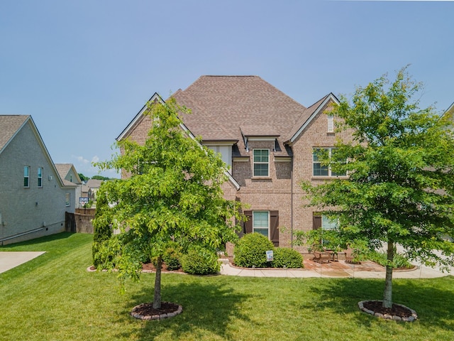 705 Rain Meadow Ct, Spring Hill, TN 37174 - traditional-style home featuring a front yard and brick siding