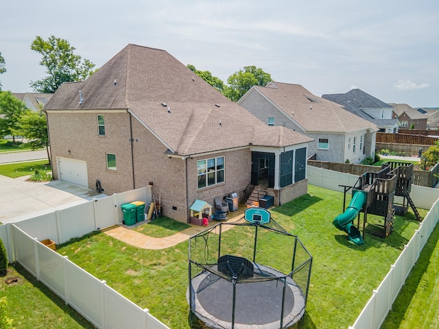 705 Rain Meadow Ct, Spring Hill, TN 37174 - rear view of property with a sunroom, an attached garage, roof with shingles, a fenced backyard, and driveway