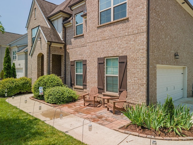 705 Rain Meadow Ct, Spring Hill, TN 37174 - view of front facade with brick siding and an attached garage