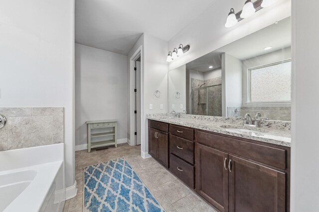 705 Rain Meadow Ct, Spring Hill, TN 37174 - full bathroom featuring a garden tub, a shower stall, double vanity, and tile patterned floors