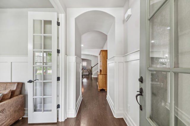 705 Rain Meadow Ct, Spring Hill, TN 37174 - hall with arched walkways, a decorative wall, dark wood finished floors, a wainscoted wall, and stairway