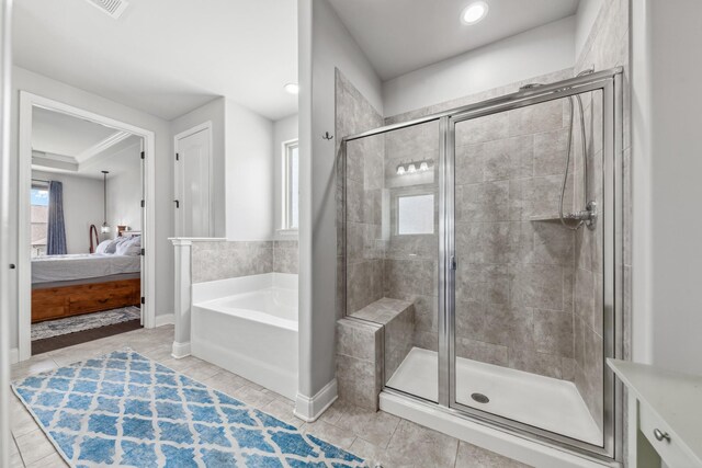 705 Rain Meadow Ct, Spring Hill, TN 37174 - bathroom with ensuite bathroom, a bath, a stall shower, tile patterned flooring, and recessed lighting