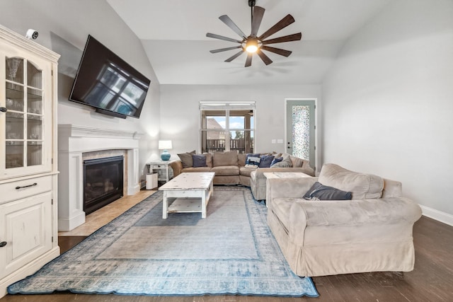 705 Rain Meadow Ct, Spring Hill, TN 37174 - living area with vaulted ceiling, ceiling fan, a glass covered fireplace, and wood finished floors