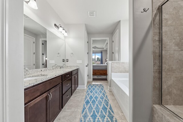 705 Rain Meadow Ct, Spring Hill, TN 37174 - bathroom with a garden tub, double vanity, connected bathroom, a tile shower, and tile patterned floors