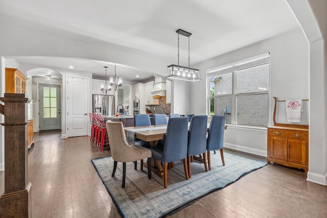 705 Rain Meadow Ct, Spring Hill, TN 37174 - dining room with arched walkways, hardwood / wood-style flooring, healthy amount of natural light, a chandelier, and recessed lighting