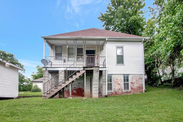714 N Poplar St, Paris, TN 38242 - rear view of house featuring a yard, stairs, roof with shingles, and a porch