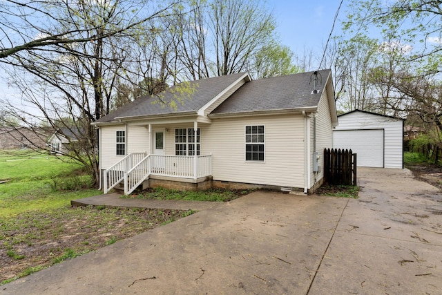 1090 Sugarberry Ln, Springfield, TN 37172 - view of front facade featuring an outdoor structure, a garage, concrete driveway, and a shingled roof