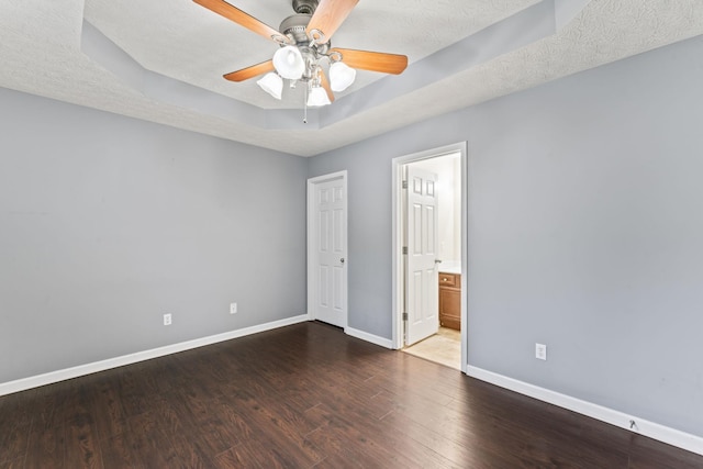1090 Sugarberry Ln, Springfield, TN 37172 - unfurnished bedroom with baseboards, wood finished floors, ensuite bathroom, and ceiling fan