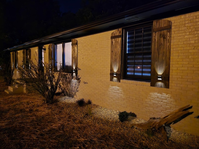 371 Leader Dr, New Johnsonville, TN 37134 - property exterior at night with brick siding