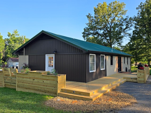 371 Leader Dr, New Johnsonville, TN 37134 - view of property exterior featuring a metal roof and a wooden deck