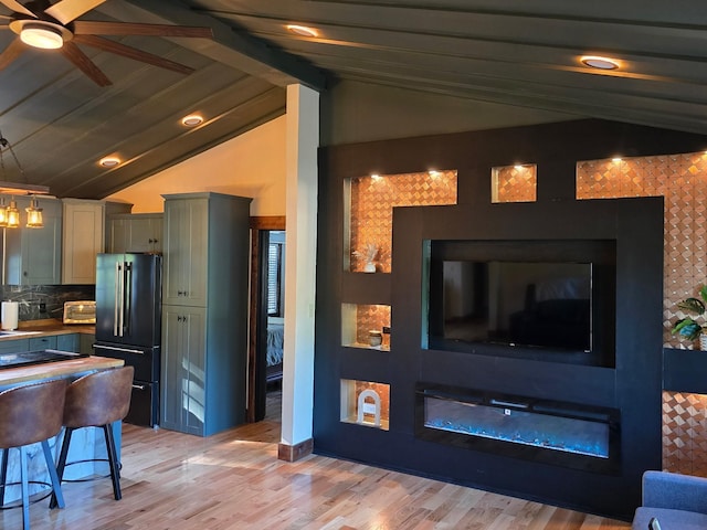 371 Leader Dr, New Johnsonville, TN 37134 - living area featuring ceiling fan, light wood finished floors, and a glass covered fireplace