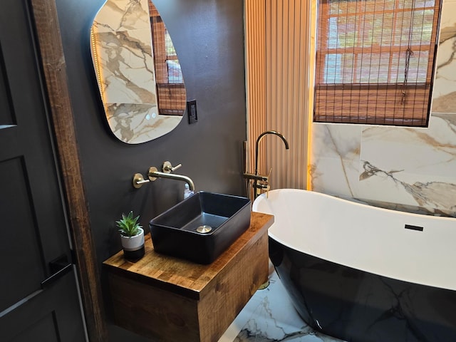 371 Leader Dr, New Johnsonville, TN 37134 - full bath with marble look tiles and a freestanding tub