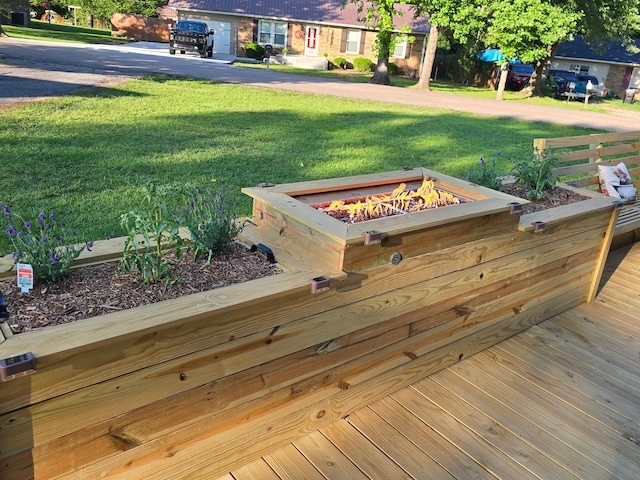 371 Leader Dr, New Johnsonville, TN 37134 - wooden terrace with an outdoor fire pit and a lawn