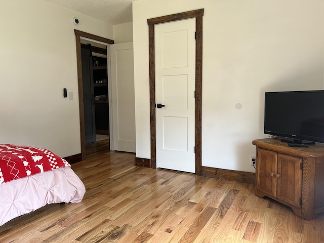 371 Leader Dr, New Johnsonville, TN 37134 - bedroom featuring light wood finished floors and baseboards
