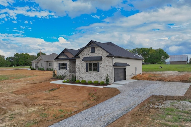796 N Leath Rd, Portland, TN 37148 - french country inspired facade featuring gravel driveway and brick siding