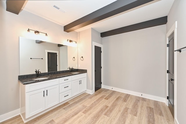 796 N Leath Rd, Portland, TN 37148 - full bath featuring double vanity, wood finished floors, beamed ceiling, and baseboards