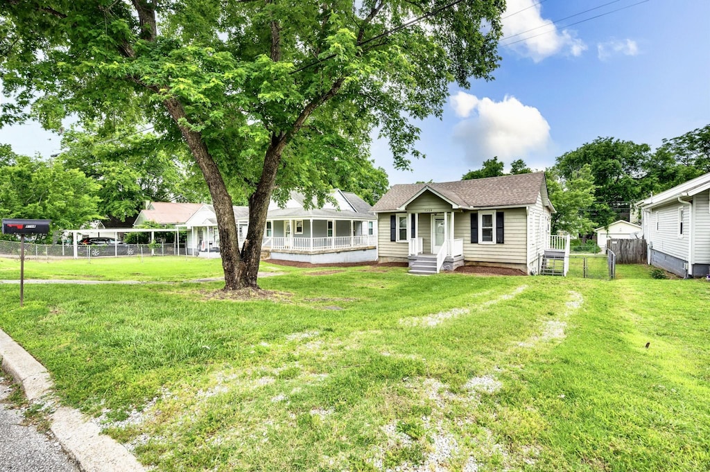 5304 Michigan Ave, Nashville, TN 37209 - view of front of house featuring covered porch and a shingled roof