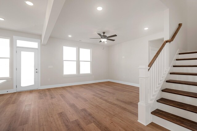 2416 Burton Dr, White House, TN 37188 - unfurnished living room featuring ceiling fan, light wood-style floors, stairs, recessed lighting, and baseboards