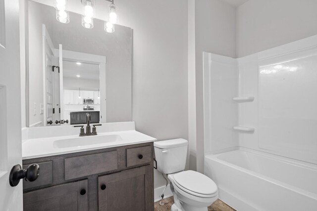 2416 Burton Dr, White House, TN 37188 - full bathroom featuring toilet, vanity, and washtub / shower combination