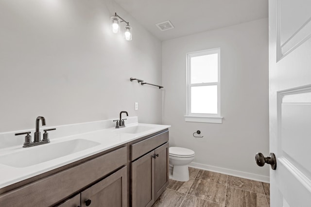 2416 Burton Dr, White House, TN 37188 - full bath with toilet, double vanity, and baseboards