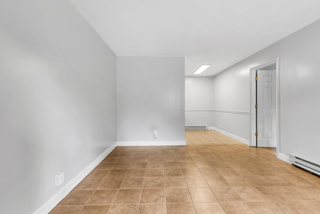 2134 Fairfax Ave Unit A1, Nashville, TN 37212 - empty room with a baseboard radiator, baseboards, and light tile patterned floors